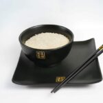 white rice on plate with chopsticks